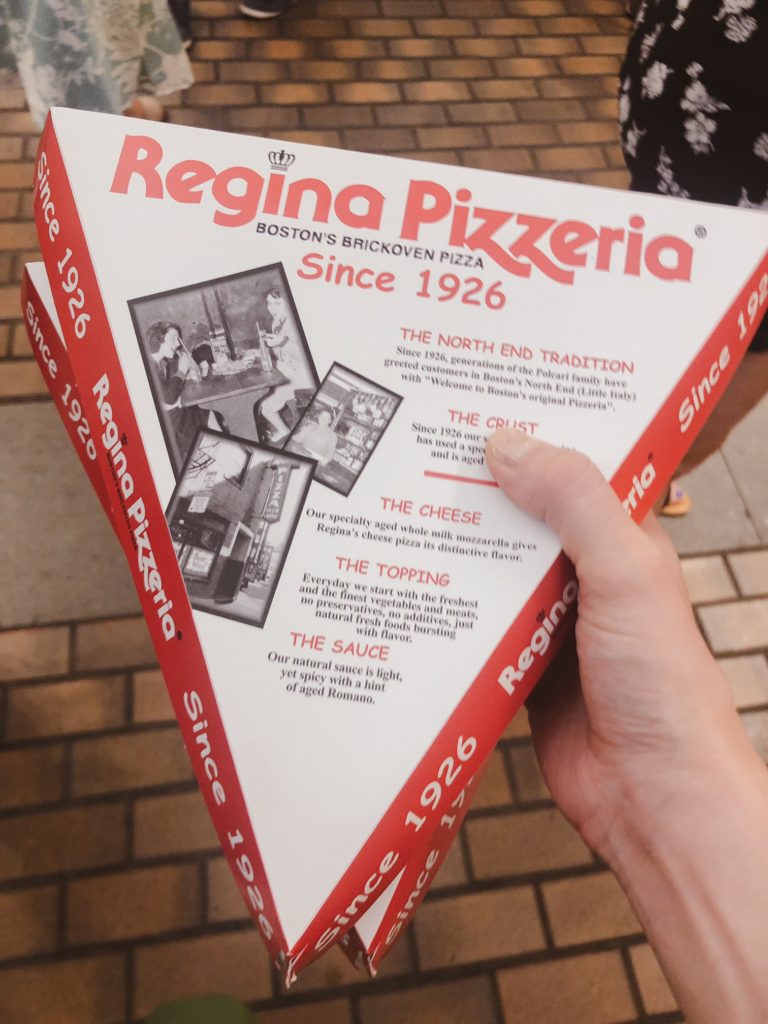 Holding Regina Pizzeria boxes in Quincy Market